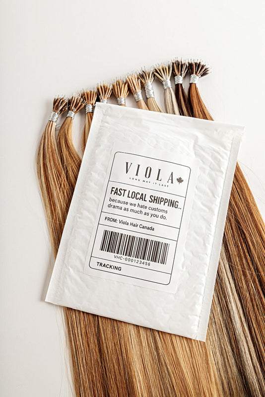 Shipping hair extensions with a 'Viola' label on a white background